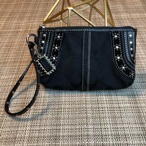 Coach Black leather zipped logo wallet.